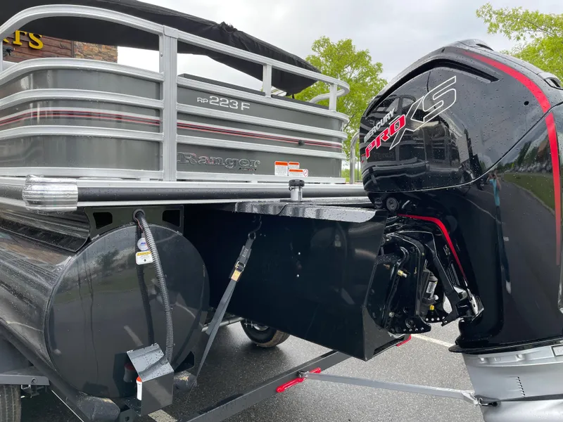 Slide: The Image of 2023 Ranger 223F pontoon boat with Pro XS outboard motor. - 3