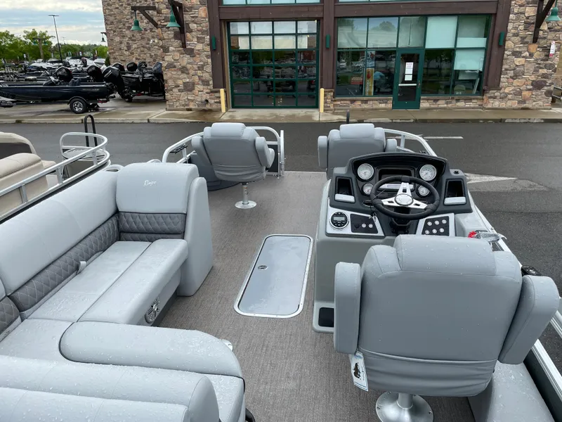 Slide: The Image of 2023 Ranger 223F boat interior with gray seating and modern dashboard. - 6