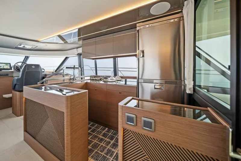 Slide: The Image of Luxurious interior of 2025 Prestige M48 yacht with modern kitchen and sleek design. - 21