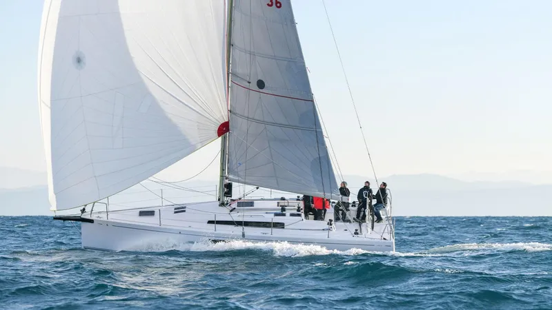 Slide: The Image of 2024 Beneteau First 36 sailboat cruising on open water. - 1