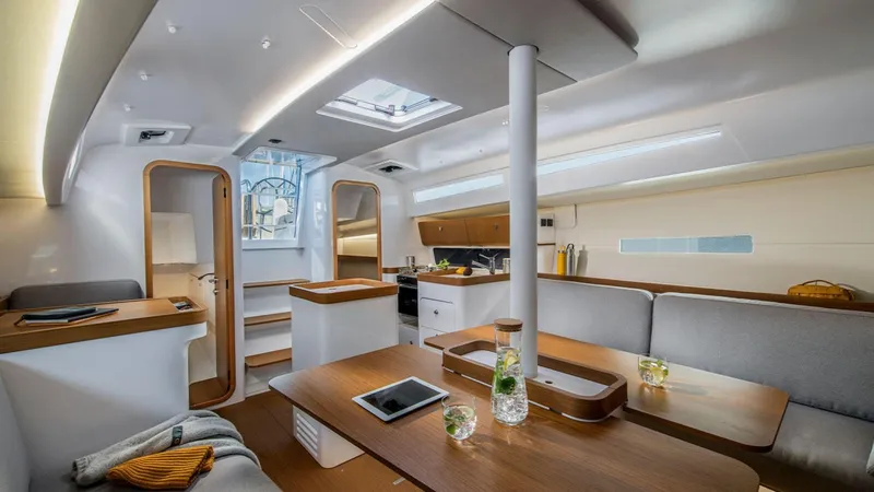 Slide: The Image of Modern interior of 2024 Beneteau First 36 sailboat with sleek design and cozy seating. - 4