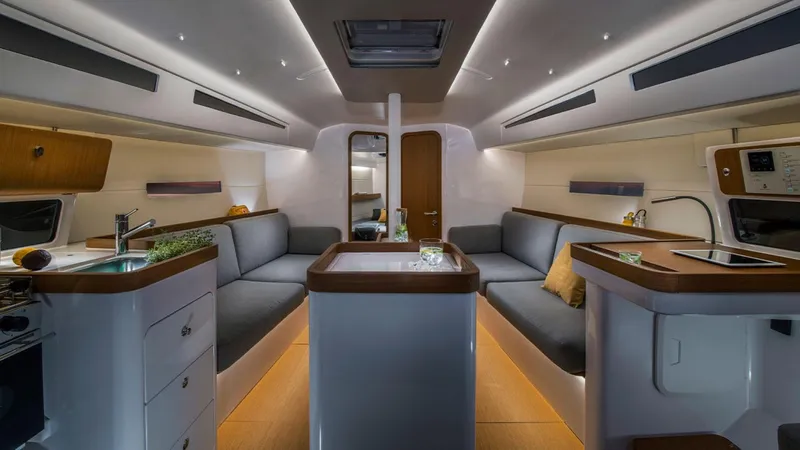 Slide: The Image of Modern interior of 2024 Beneteau First 36 sailboat with sleek design and cozy seating. - 8