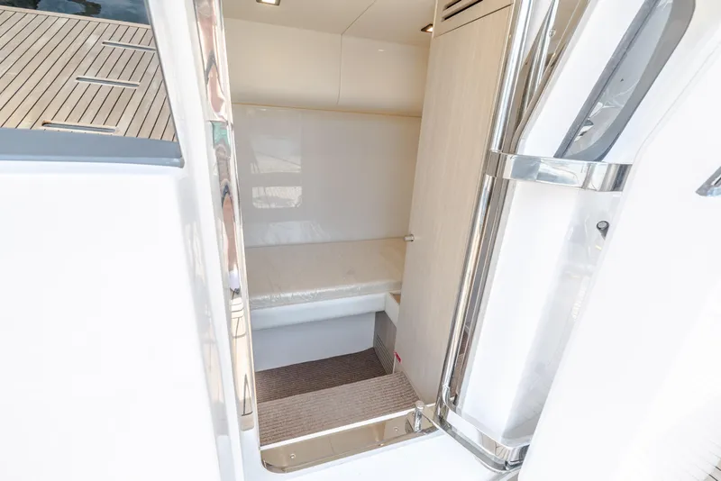 Slide: The Image of Interior cabin of 2025 Sirena 58 yacht with modern design and wooden accents. - 13