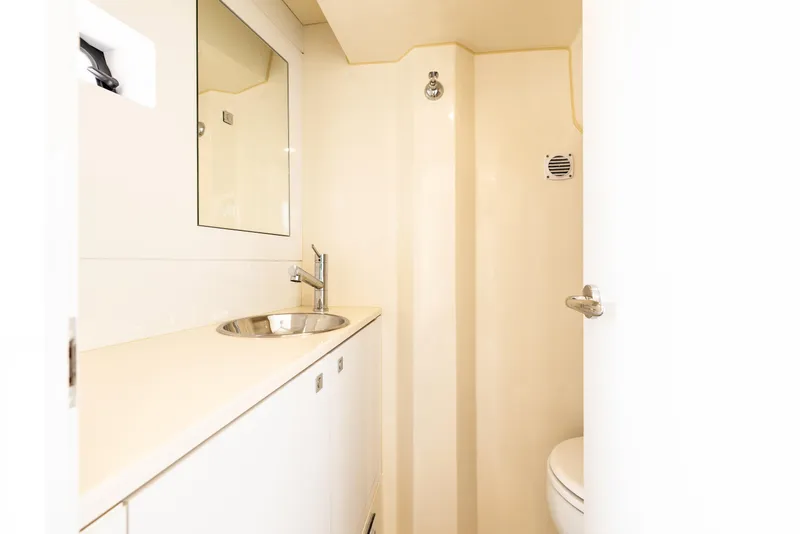 Slide: The Image of Modern bathroom in 2025 Sirena 58 yacht with sink, mirror, and toilet. - 14