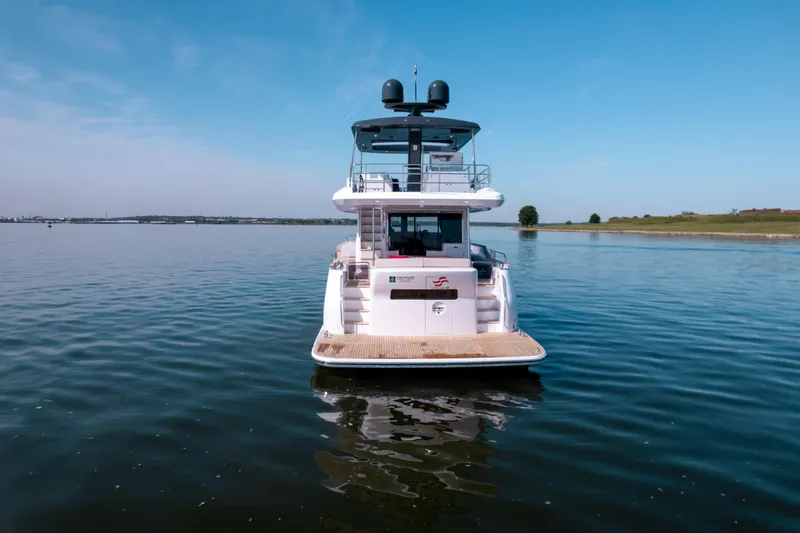 Slide: The Image of 2025 Sirena 58 yacht on calm water, rear view. - 3