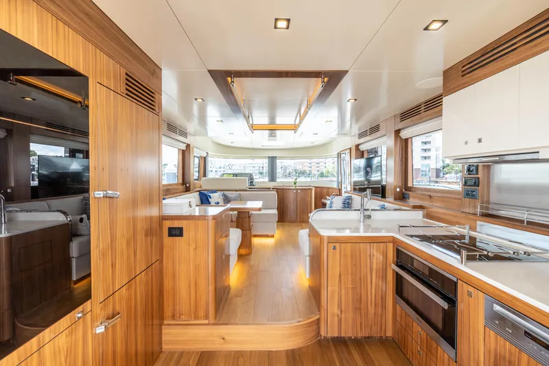 Slide: The Image of Luxurious interior of 2025 Sirena 58 yacht with modern kitchen and dining area. - 32