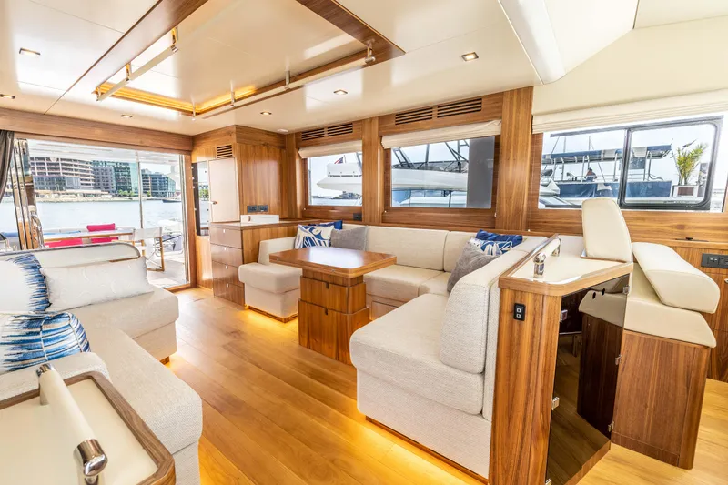 Slide: The Image of Luxurious interior of the 2025 Sirena 58 yacht with modern furnishings and ample natural light. - 37