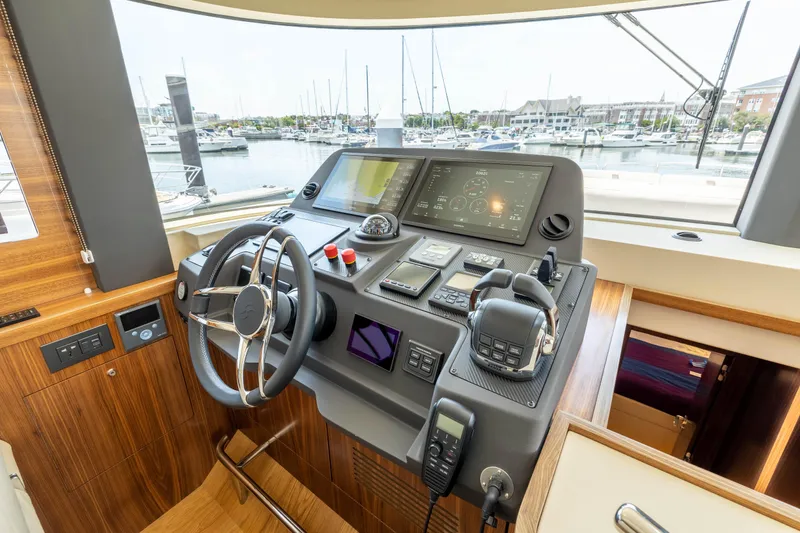 Slide: The Image of Helm station of 2025 Sirena 58 yacht with modern navigation equipment. - 39