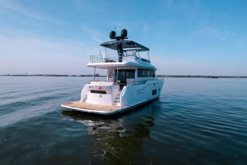 Slide: The Image of Luxury Sirena 58 yacht, 2025 model, cruising on calm waters under a clear sky. - 4