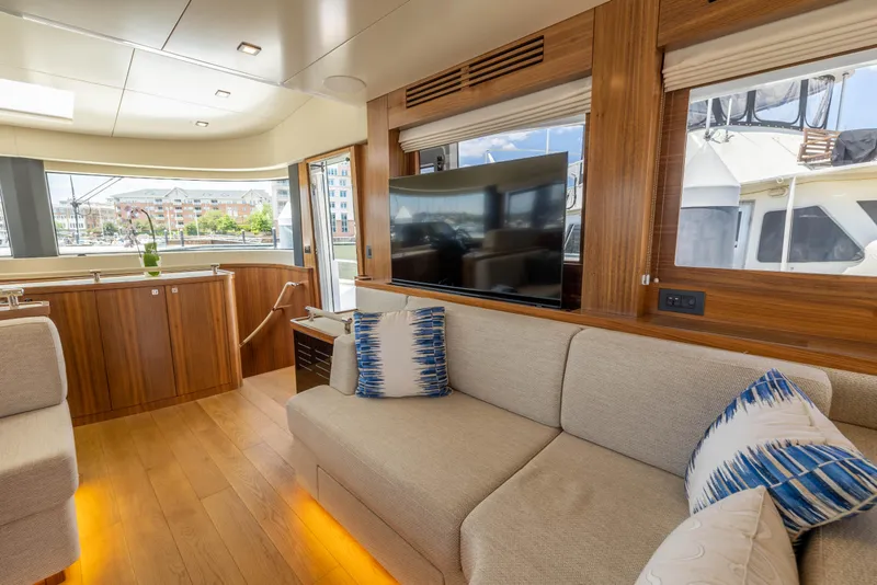 Slide: The Image of Modern interior of 2025 Sirena 58 yacht with cozy seating and large TV. - 40