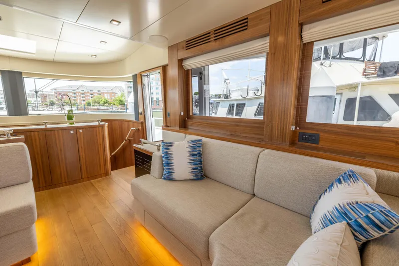 Slide: The Image of Luxurious interior of 2025 Sirena 58 yacht with modern wood finishes and comfortable seating. - 41