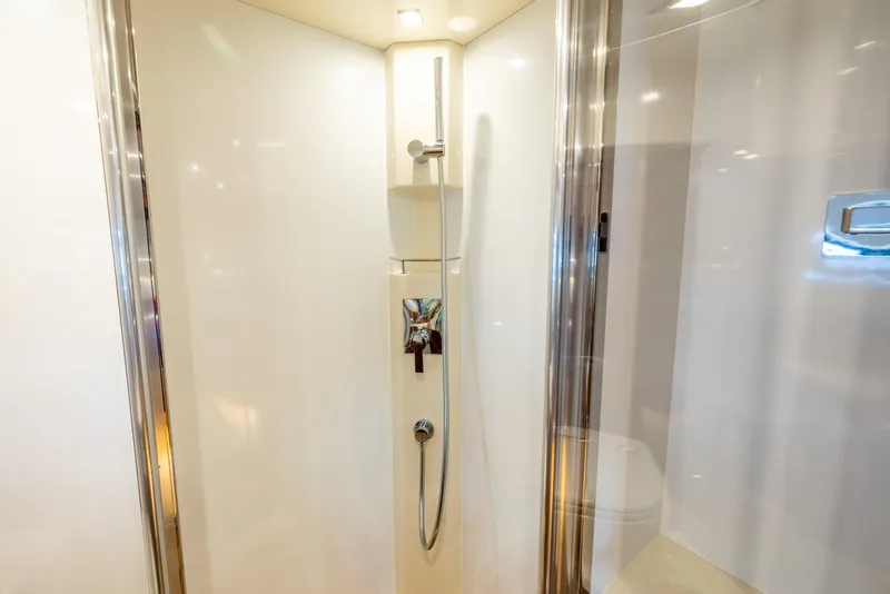 Slide: The Image of Modern shower area in 2025 Sirena 58 yacht with sleek design and chrome fixtures. - 45
