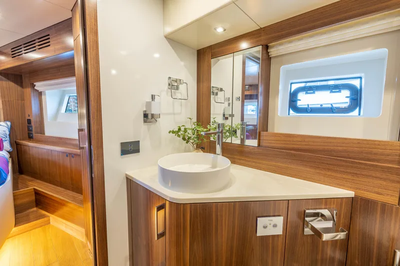 Slide: The Image of Luxurious bathroom interior of 2025 Sirena 58 yacht with modern fixtures and wooden accents. - 46