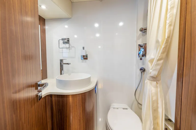 Slide: The Image of Modern bathroom in 2025 Sirena 58 yacht with wood accents and sleek fixtures. - 49