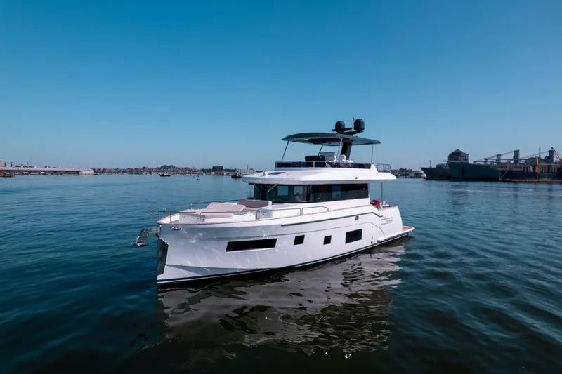 Slide: The Image of 2025 Sirena 58 yacht on calm waters with clear blue sky. - 5