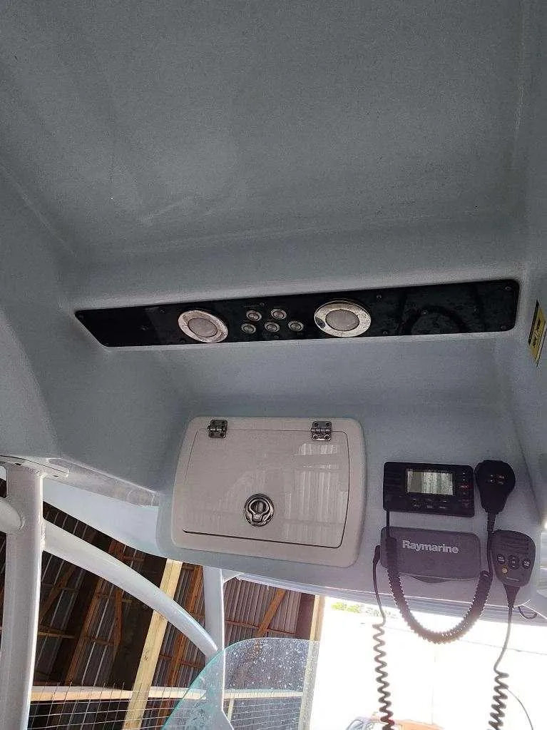 Slide: The Image of 2015 Sea Fox 286 Commander boat console with electronics and storage. - 12