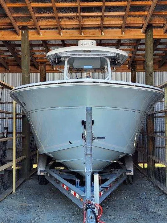 Slide: The Image of 2015 Sea Fox 286 Commander boat on a trailer in a covered storage area. - 15