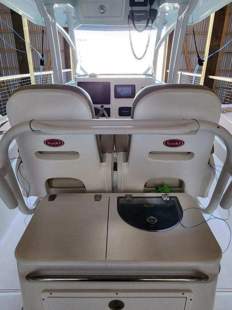 Slide: The Image of 2015 Sea Fox 286 Commander boat interior with dual seats and control panel. - 20