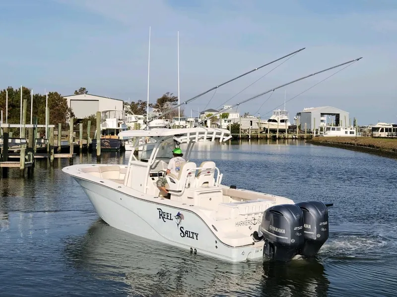 Slide: The Image of 2015 Sea Fox 286 Commander boat with dual Yamaha engines in a marina. - 3