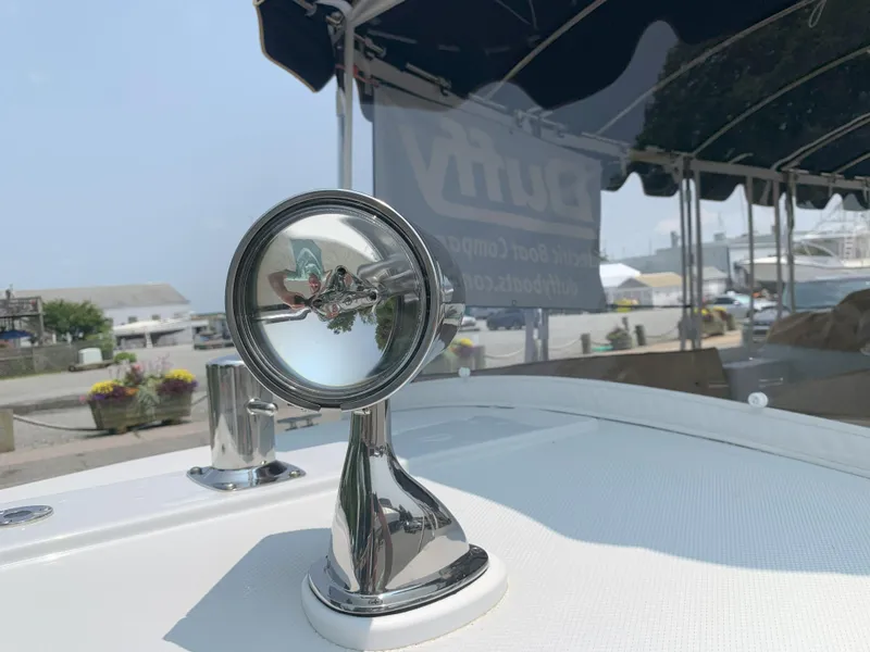 Slide: The Image of Close-up of 2022 Duffy Snug Harbor 18 boat's chrome spotlight. - 10