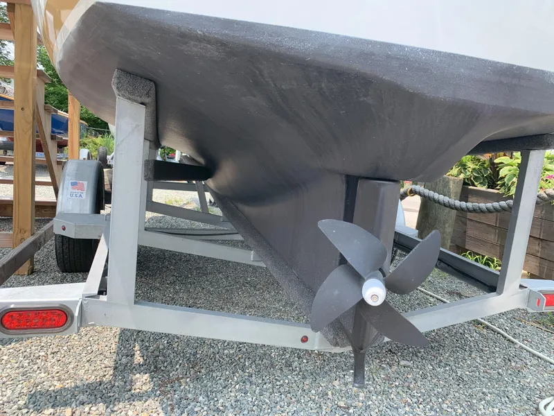 Slide: The Image of 2022 Duffy Snug Harbor 18 boat propeller and hull on trailer. - 11
