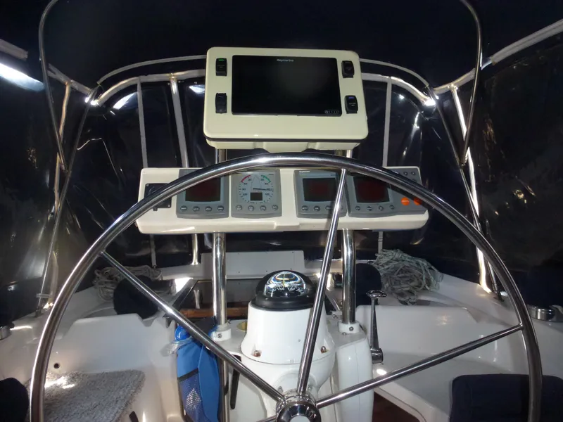 Slide: The Image of Cockpit of a 2001 Hunter 420 Passage sailboat with navigation instruments. - 11