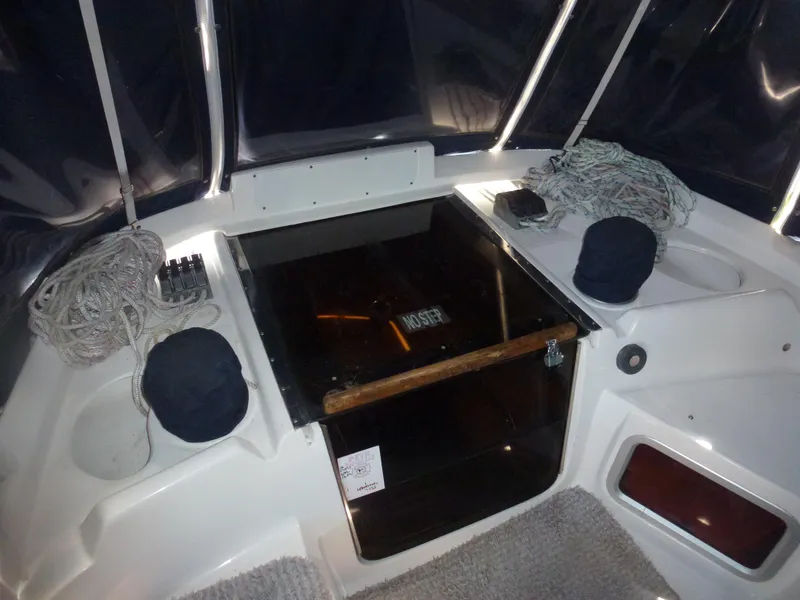Slide: The Image of Cockpit of 2001 Hunter 420 Passage sailboat with ropes and covered instruments. - 12