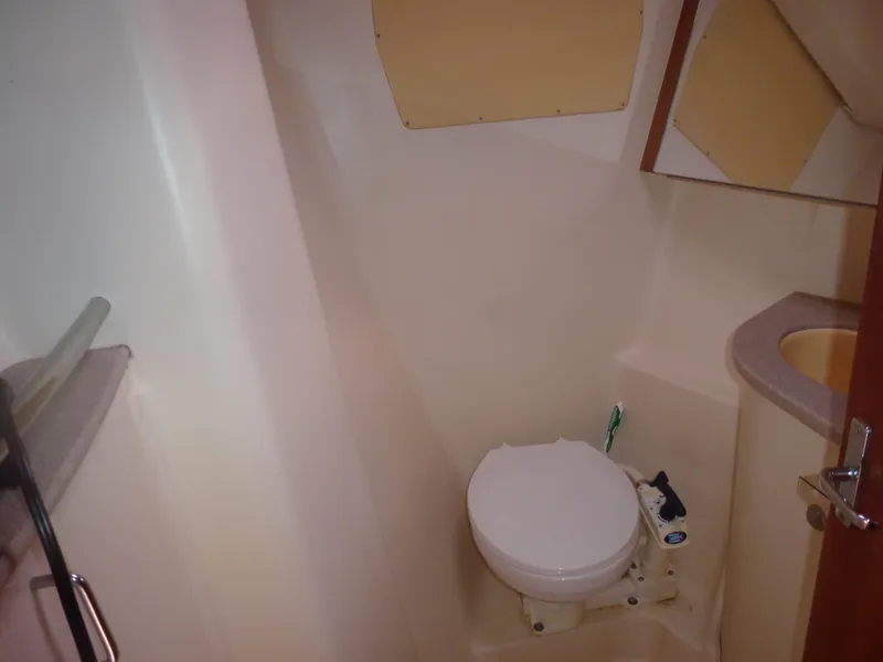 Slide: The Image of Compact bathroom in 2001 Hunter 420 Passage sailboat with toilet and sink. - 13