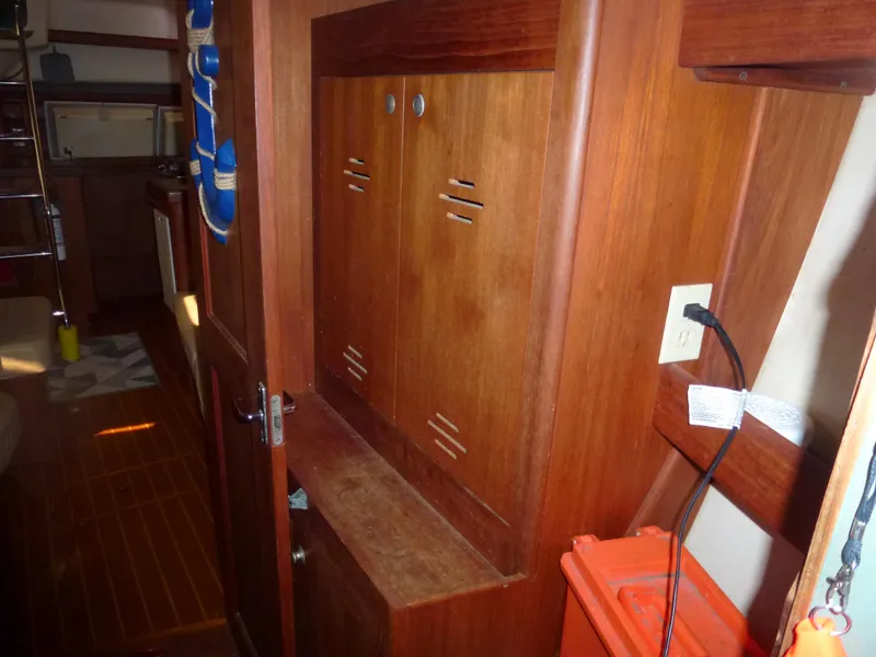 Slide: The Image of 2001 Hunter 420 Passage interior with wooden cabinets and storage space - 15