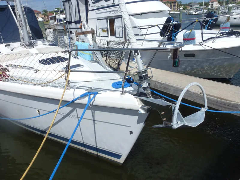 Slide: The Image of 2001 Hunter 420 Passage sailboat docked at marina, bow view with anchor. - 2