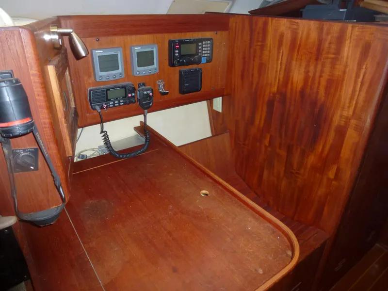 Slide: The Image of Navigation station of 2001 Hunter 420 Passage sailboat with communication equipment. - 28