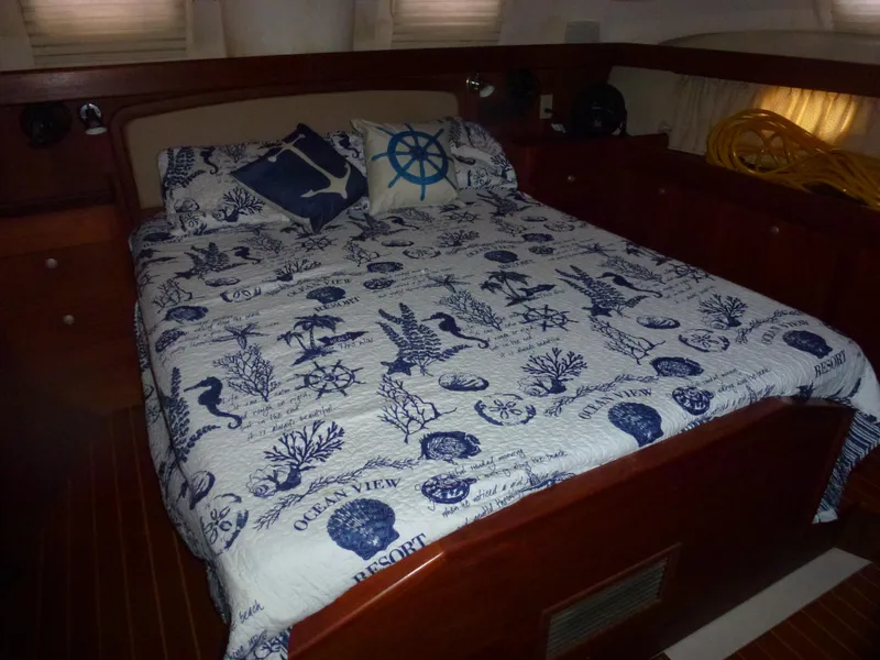 Slide: The Image of Nautical-themed bedroom in a 2001 Hunter 420 Passage sailboat. - 32