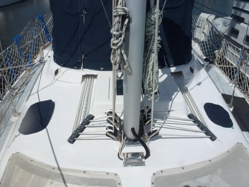 Slide: The Image of Deck of 2001 Hunter 420 Passage sailboat with rigging and netting. - 6