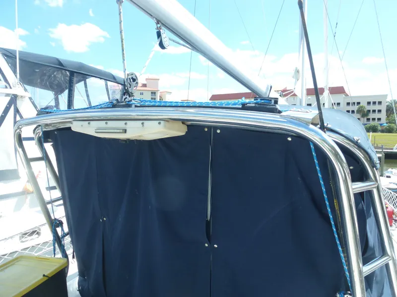 Slide: The Image of 2001 Hunter 420 Passage sailboat with blue canvas cover and stainless steel frame. - 9