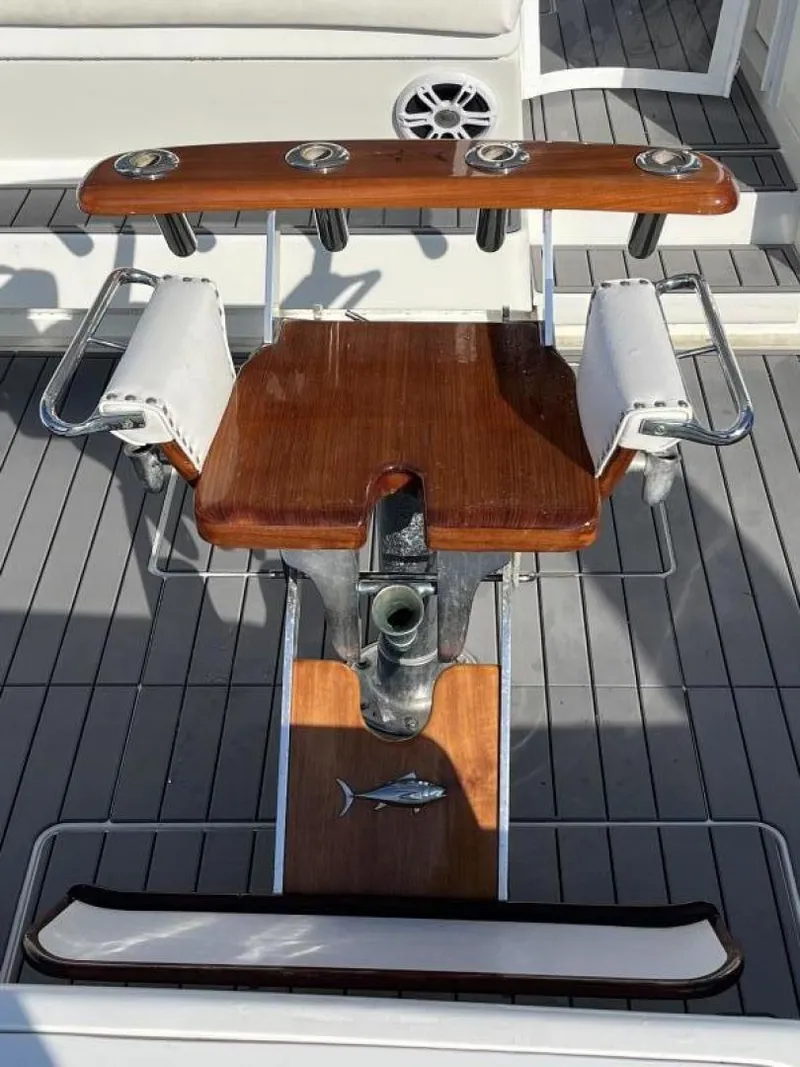 Slide: The Image of Fishing chair on 1993 Bertram 46 Moppie boat with teak accents. - 14