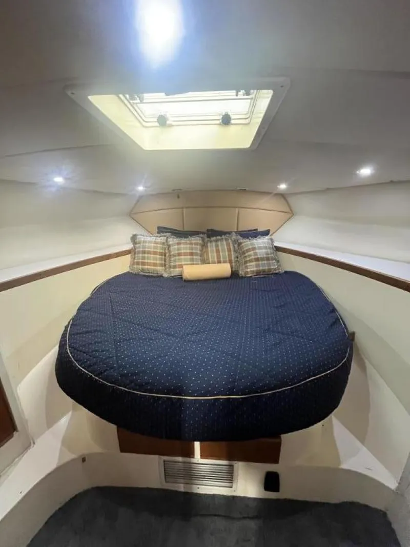 Slide: The Image of 1993 Bertram 46 Moppie cabin with a cozy bed and skylight. - 9