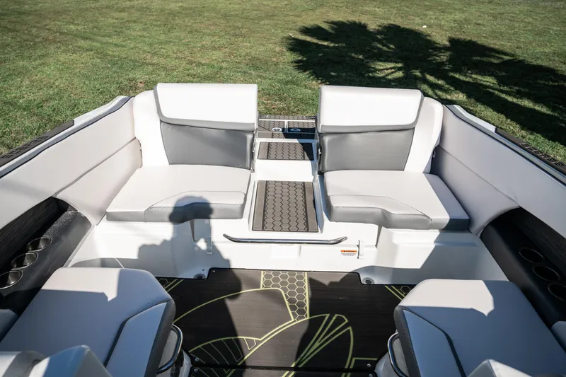 Slide: The Image of 2022 Scarab 255 boat interior with white and gray seating. - 11