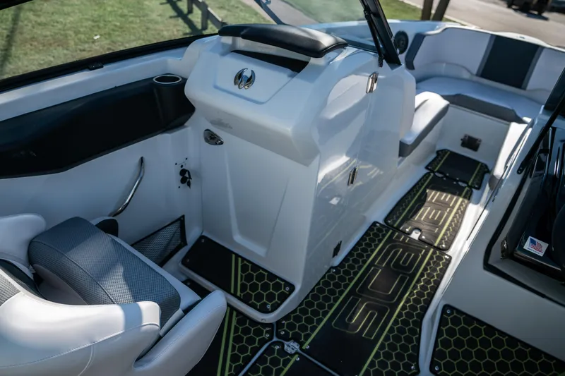 Slide: The Image of Interior of a 2022 Scarab 255 boat with modern seating and dashboard. - 12