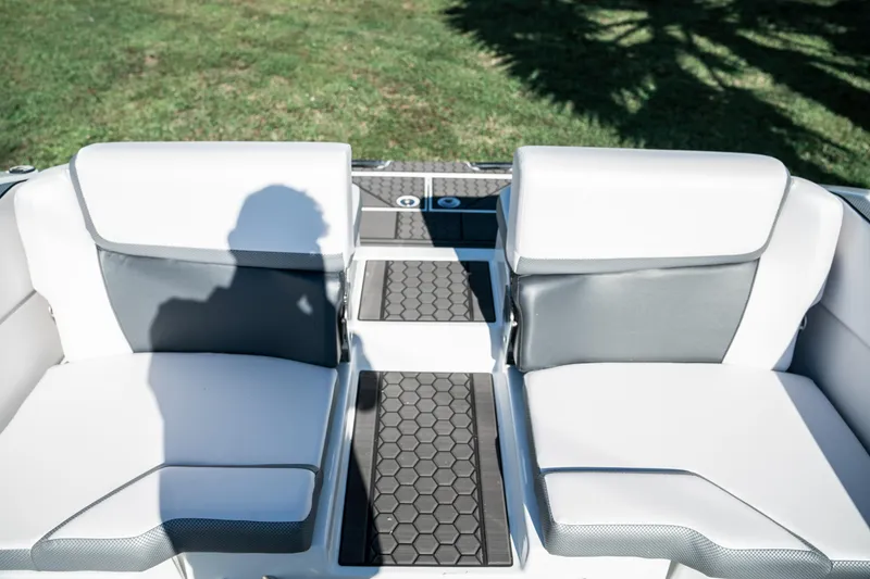 Slide: The Image of 2022 Scarab 255 boat interior with white and gray seating. - 15