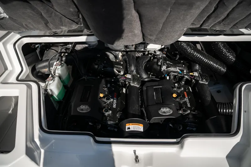 Slide: The Image of Engine compartment of a 2022 Scarab 255 boat with twin Rotax engines. - 18