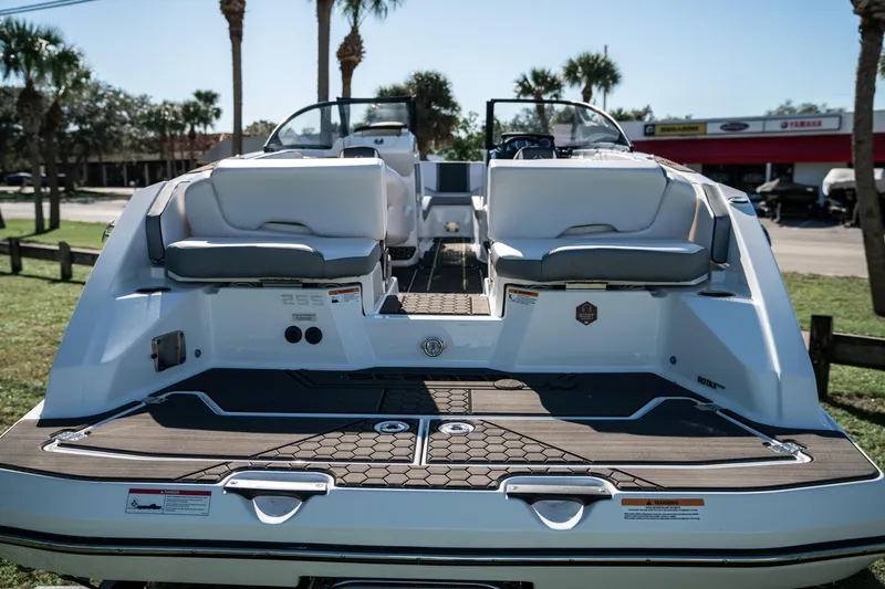 Slide: The Image of 2022 Scarab 255 boat rear view with seating and deck. - 4