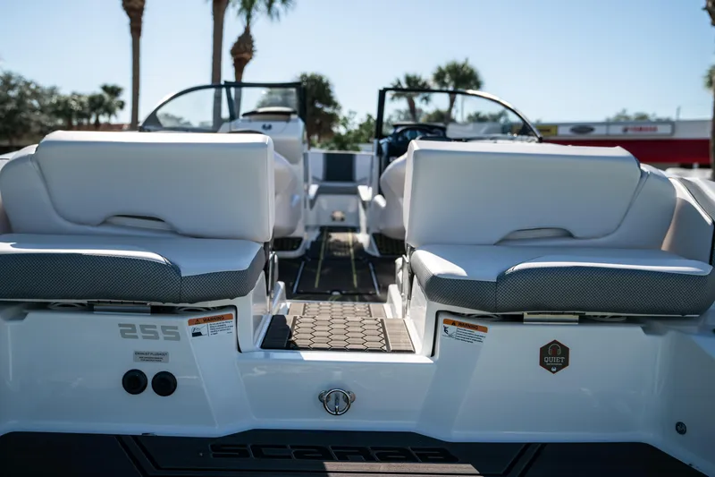 Slide: The Image of 2022 Scarab 255 boat with white seating and modern design. - 8