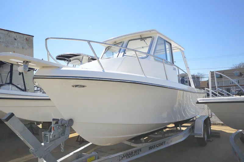 Slide: The Image of 2023 May-Craft 23 Pilothouse boat on trailer, side view. - 4