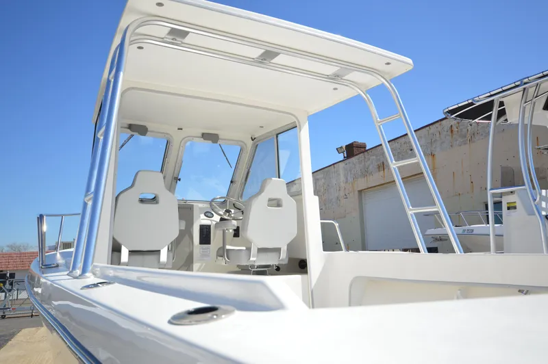 Slide: The Image of 2023 May-Craft 23 Pilothouse boat with white interior and modern design. - 7