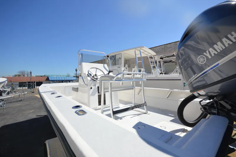 Slide: The Image of 2023 May-Craft 19 HANCOCK boat with Yamaha engine, docked under clear blue sky. - 4
