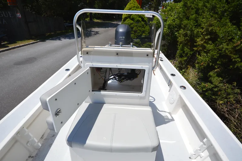 Slide: The Image of 2023 May-Craft 19 Hancock boat interior with open storage compartment. - 7