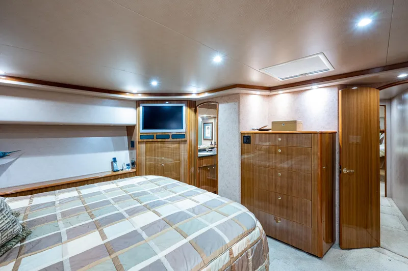Slide: The Image of Viking 74 Convertible Reel Estate - Master Stateroom, Walkaround Berth, TV, Drawer Storage - 14