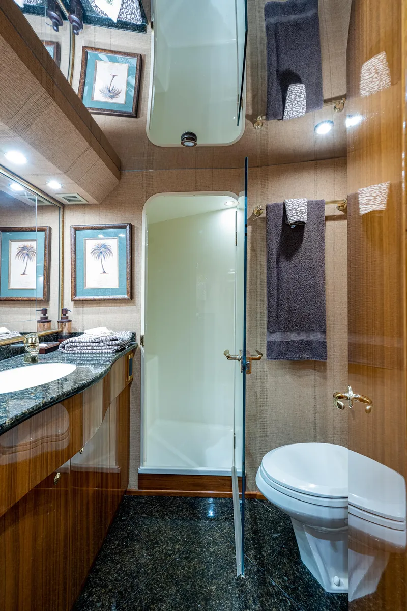 Slide: The Image of Viking 74 Convertible Reel Estate - Master Stateroom Head, Walk In Shower, Head, Sink with Vanity - 20