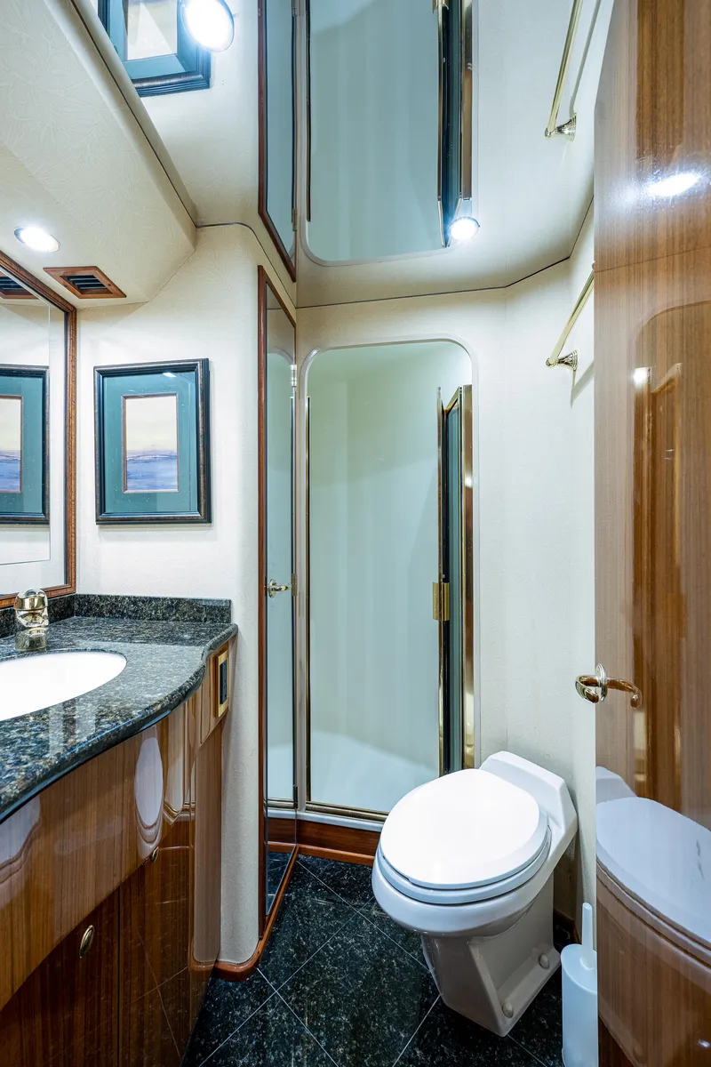 Slide: The Image of Viking 74 Convertible Reel Estate - Forward Guest Head, Walk In Shower, Vanity with Sink and Head - 25