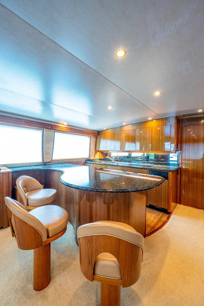 Slide: The Image of Viking 74 Convertible Reel Estate - Galley, Counter Seating, 3 Couter Height Stools - 5